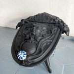Antique cast iron coalbox by Corneau Frères with bearded mascaron and hinged lid