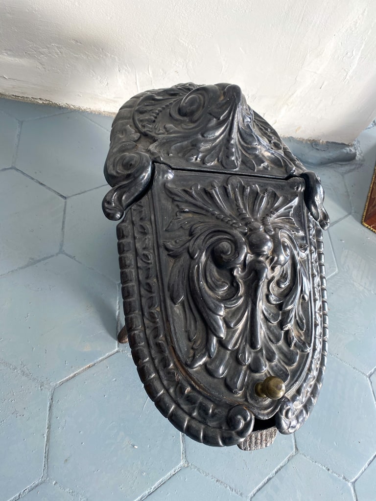 Antique cast iron coal scuttle with acanthus decor and hinged lid