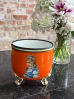 orange porcelain planter in Biedermeier and Neo-Rococo style featuring hand painted children portraits on gilded feet`