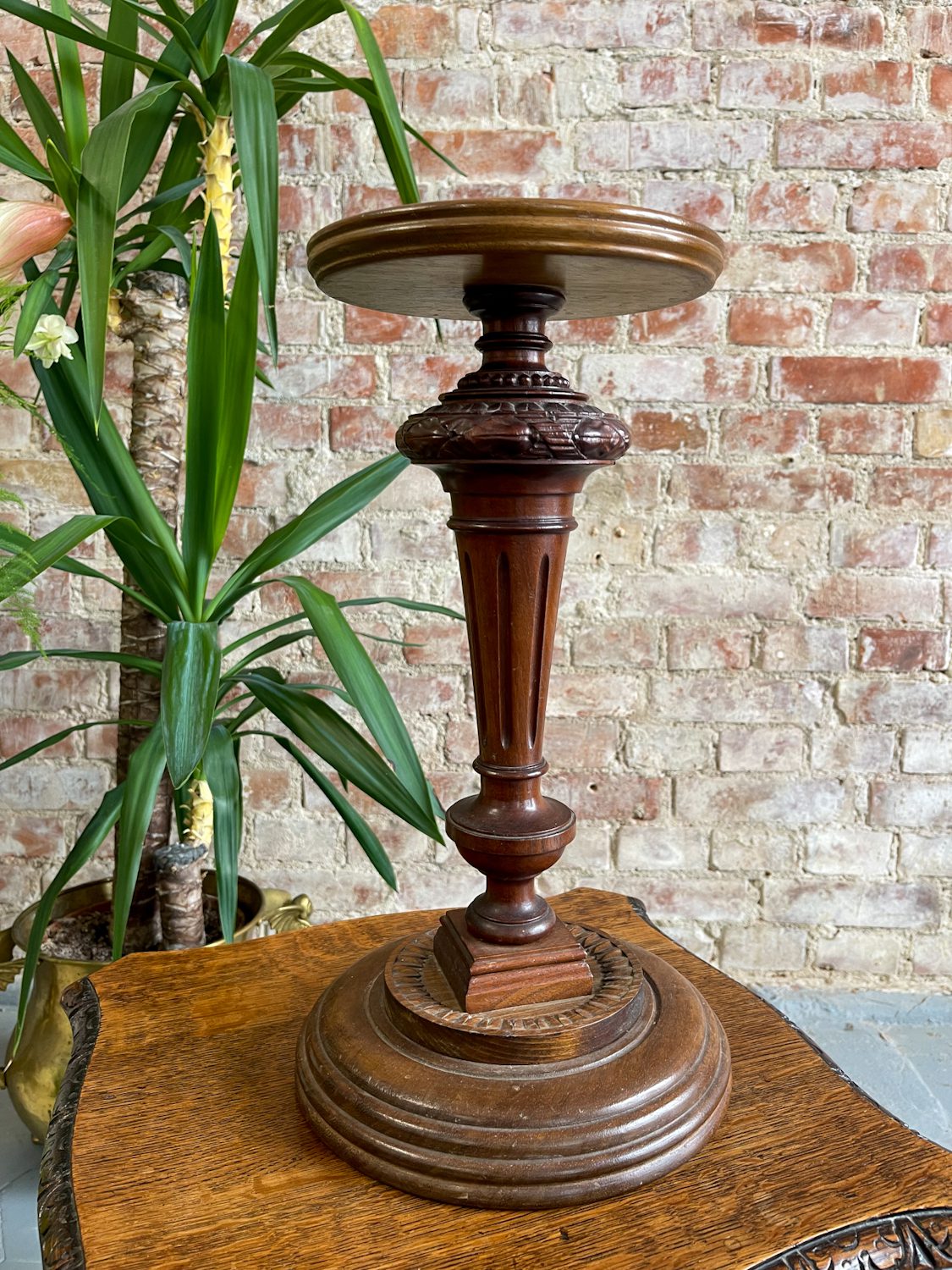 small carved wood pedestal stand