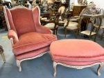 Antique French Louis XV style bergère wingback armchair with matching ottoman in terracotta velvet