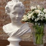Beautiful small white plaster bust of a youth