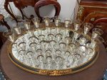 Antique French Baccarat style crystal stemware collection featuring four distinct sizes with elegant hand-painted geometric gold gilt rims.
