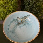 large blue bowl birds