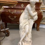 Heavy signed white garden statue of a woman with a jug