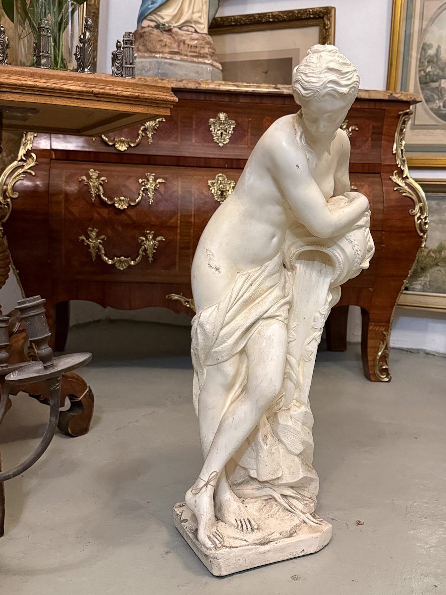 Heavy signed white garden statue of a woman with a jug