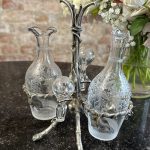 Antique glass cruet set with Britannia metal stand in art nouveau style