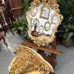 Elegant rococo revival mirror and console table with ornate floral frame