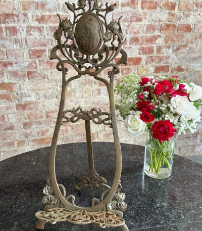 Large art nouveau table easel made of metal with iris flowers and female profile