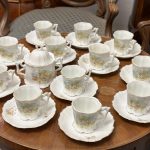 antique Carl Tielsch Altwasser silesian porcelain tea cups and saucers with delicate pink apple blossoms pattern for twelve persons