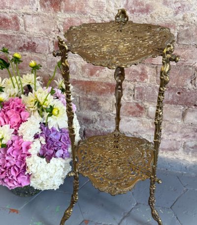 Pierced brass two-tier plant stand with rococo openwork shelves and vine legs