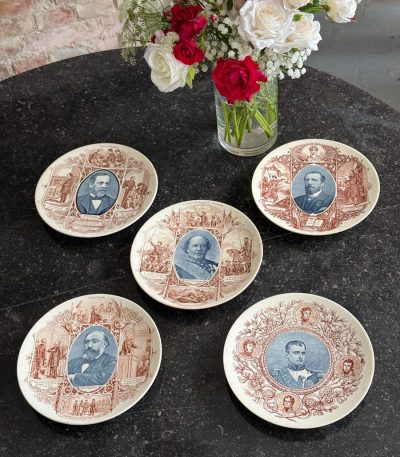 five antique faience plates with historical French portraits from Sarreguemines