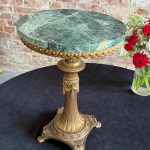 Small green marble table with brass column and paw feet