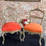 Pair of antique green and gold rococo parlor chairs with orange upholstery