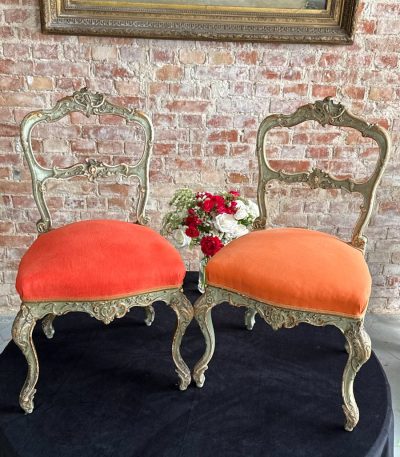 Pair of antique green and gold rococo parlor chairs with orange upholstery