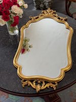 gilt rococo wall mirror with carved acanthus crest in louis xv style