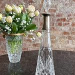 Antique crystal decanter with silver collar and engraved monogram