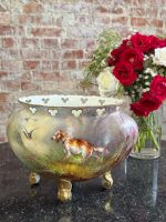 Antique hand-painted limoges porcelain cachepot featuring a hunting dog setter and flying duck motif with gold rocaille feet in Neo-Rococo style.