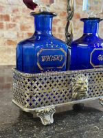 Antīks dzērienu karafeļu komplekts apsudrabotā statīvā ar lauvas galvām un ķepām (Antique decanter set in a silver-plated stand) (6404) - Image 9