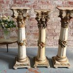 Painted wood Corinthian column pedestal in cream with pastel and gilt accents