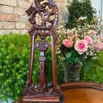 Antique French mahogany tabletop easel with ornate hand carved Rococo scrolling openwork shell and acanthus leaf finial.