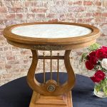 Antique low walnut table with a lyre base