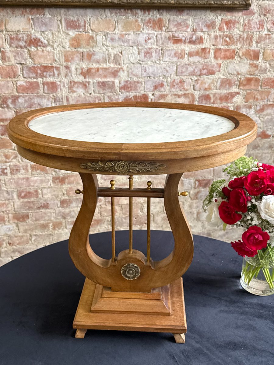 Antique low walnut table with a lyre base