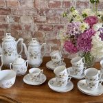 antique porcelain tea set with floral pattern