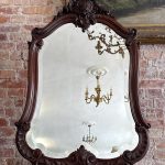 carved rosewood mirror with monogram crest