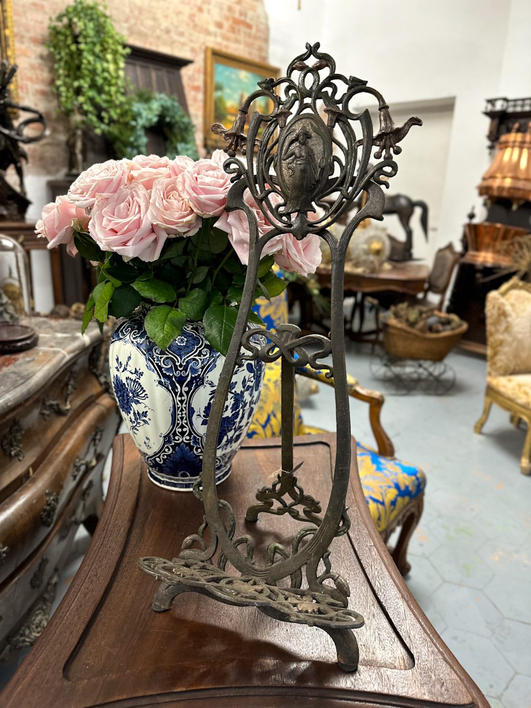 IMG_9944 Antique French Art Nouveau cast metal display easel featuring a central cameo medallion of a classical maiden flanked by sculpted lily blossoms.