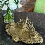 Antique brass inkstand with double inkwells and neorenesanse mascaron