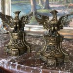 Pair of antique gilt-bronze eagle andirons on neoclassical plinths